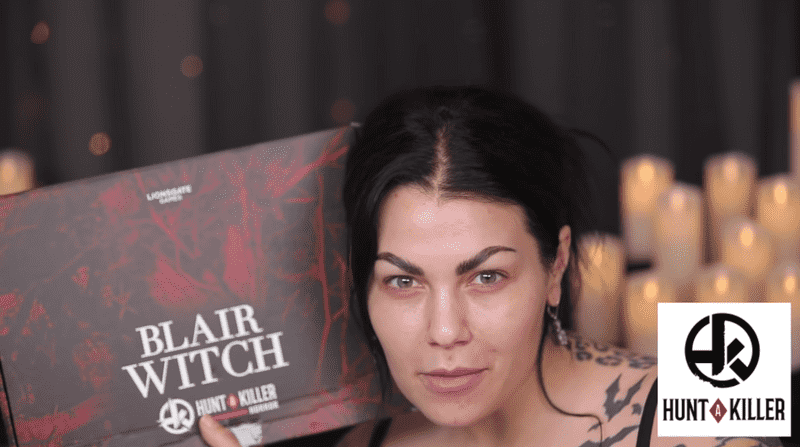 Bailey Sarian holding a Hunt A Killer Blair Witch box